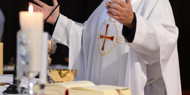 priest and worship at the altar