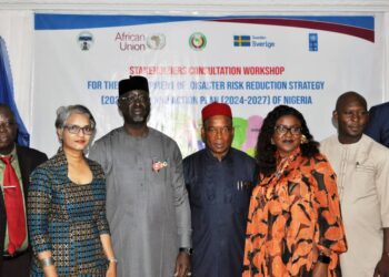 DG NEMA, Mustapha Habib Ahmed (middle) flanked by participants at the Disaster Risk Reduction Strategy workshop in November