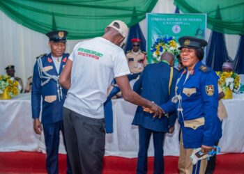 Congratulatory hand shake with Anambra State Commandant